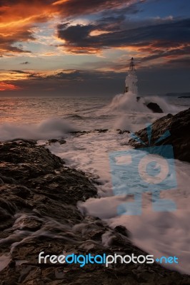 The Lighthouse And The Sea Stock Photo
