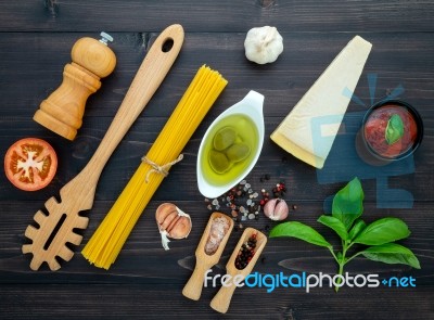 The  Pasta On Black Wooden Background. Yellow Italian Pasta With… Stock Photo