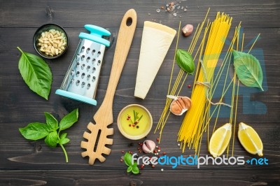 The Thin Spaghetti On Black Wooden Background. Yellow Italian Pa… Stock Photo
