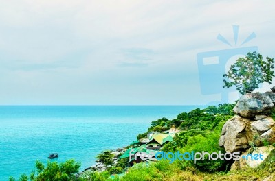 The View Of Sand Beach And Sea Wave With Rock And Cloudy On Afternoon Stock Photo