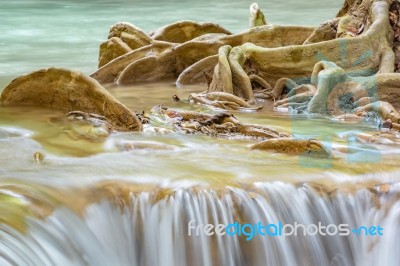 The Water Flowing Over Rocks And Trees Down A Waterfall At Huay Mae Khamin Waterfall National Park ,kanchana Buri In Thailand Stock Photo