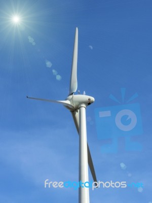 The  Wind Turbine On Blue Sky Stock Photo