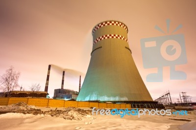 Thermal Power Plant And Cooling Towers At Night Stock Photo