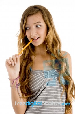 thoughtful Teenage Girl With Pencil Stock Photo