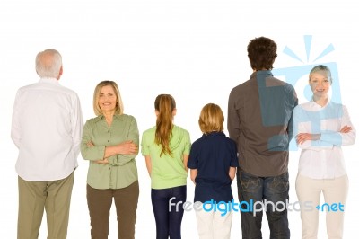 Three Generations Family Standing Isolated On White Background Stock Photo
