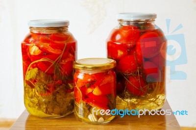 Three Glass Jars With Marinated Tomatoes Homemade Stock Photo