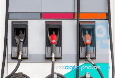 Three Refuel Nozzles In Gas Station Stock Photo