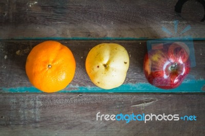 Three Types Of Fruit  On A Wooden Stock Photo