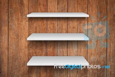 Three White Shelves On Wooden Interior Texture Background Stock Photo