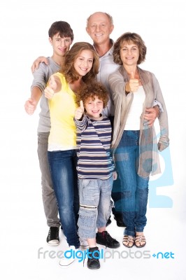 Thumbs-up Family Posing In Style Stock Photo