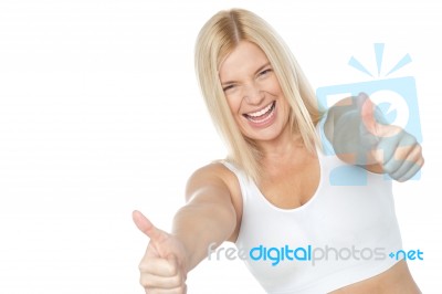 Tilted Image Of Cheerful Lady Showing Thumbs Up Stock Photo