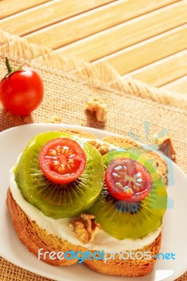 Toast With Kiwi, Cheese And Cherry Tomato Stock Photo