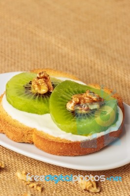 Toast With Kiwi, Cheese And Walnuts Stock Photo