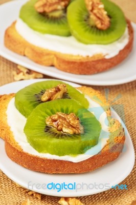 Toast With Kiwi, Cheese And Walnuts Stock Photo