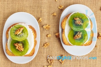 Toast With Kiwi, Cheese And Walnuts Stock Photo