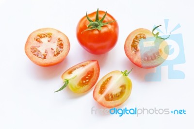 Tomato And Pieces Of Fresh Tomato Isolated On White Stock Photo