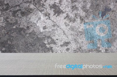 Top Of Wood Table On Old Concrete Wall Background Stock Photo