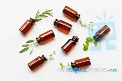 Top View, Bottle Of Essential Oil With Herbs  Sage, Rosemary, Or… Stock Photo