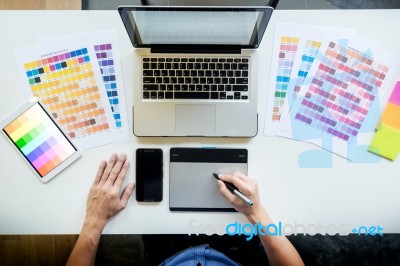 Top View Of A Young Graphic Designer Working On A Desktop Comput… Stock Photo