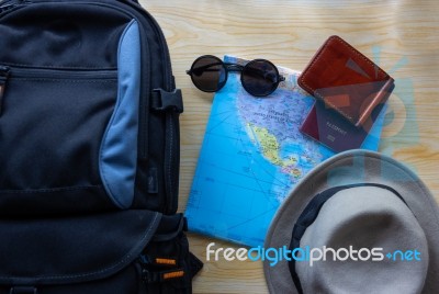 Top View Of  Backpack Bag With Other Travel Accessories On Woode… Stock Photo