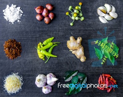 Top View Of Food Ingredients And Condiment On The Table, Ingredients And Seasoning On Dark Wooden Floor Stock Photo