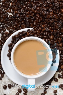 Top View Of Hot Coffee Cup And Beans Stock Photo