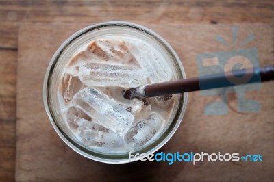 Top View Of Iced Coffee On Wooden Table Stock Photo