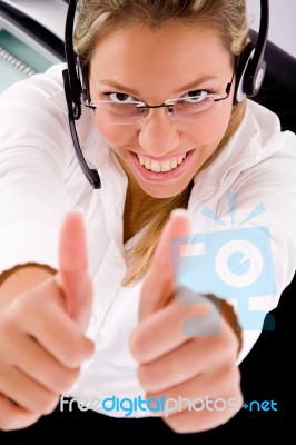 Top View Of Smiling Service Showing Thumb Up Stock Photo