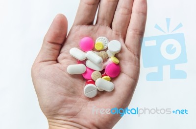 Top View Of The Pills On The Hand And White Background, A Hand Hold The Pills And Drug Stock Photo