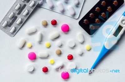 Top View Of The Pills On The White Background, Pack Of Tablet Drug And Capsule Pills On The Floor Stock Photo