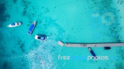 Top View Of Tourist Speed Boat Approaching To Floating Port In Phuket Island Andaman Sea Thailand Stock Photo