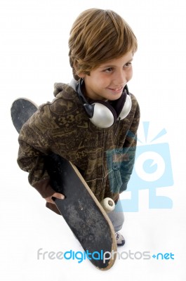 Top View Of Urban Kid Holding Skateboard Stock Photo
