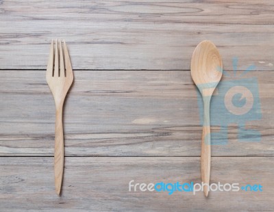 Top View Of Wood Spoon And Fork On Wooden Table Stock Photo