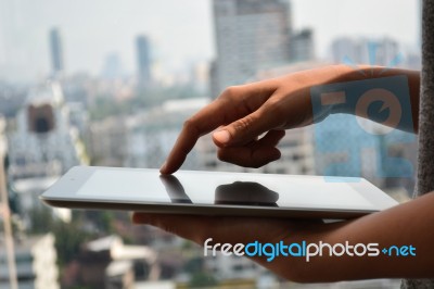 Touching Screen Of A Tablet Computer Stock Photo