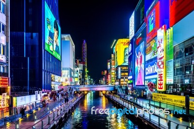 Tourist Walking In Night Shopping Street At Dotonbori In Osaka, Japan  Stock Photo