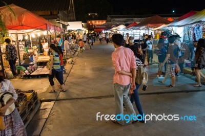 Tourists Walk To Shop At Night Market Srinakarin Road Or Train Market, Thailand Stock Photo