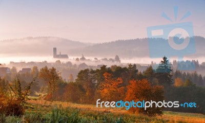 Tower Of Rural Church In Misty Autumn Morning Stock Photo