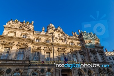 Townhall In Lyon With French Flag Stock Photo