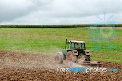 Tractor Ploughing Field Stock Photo