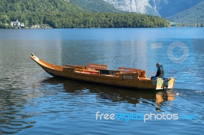 Traditional Flat Bottomed Boat On Lake Hallstatt Stock Photo