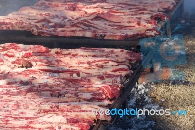 Traditional Meat Grilled On The Grill In The Argentine Countryside Stock Photo
