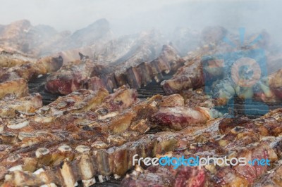 Traditional Meat Grilled On The Grill In The Argentine Countryside Stock Photo