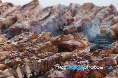 Traditional Meat Grilled On The Grill In The Argentine Countryside Stock Photo