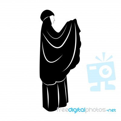 Traditionally Clothed Muslim Woman Making A Supplication (salah) While Standing On A Praying Rug Against Stock Image