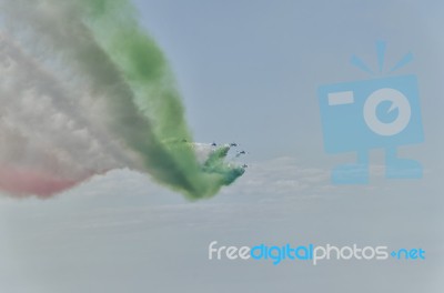 Trail Of Colored Smoke Draw The Italian Flag Stock Photo