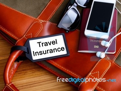 Travel Insurance Tag On Travel Bag Stock Photo