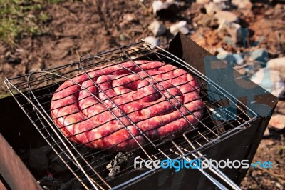 Travel Kielbasa Cooking. Uncooked Sausages Stock Photo