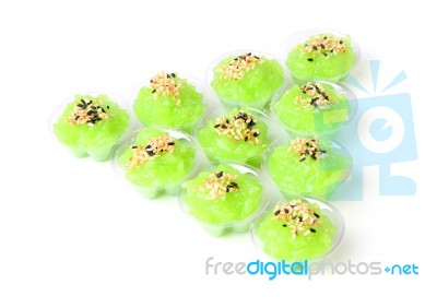 Triangle Of Pandan Flavored Sweet Translucent Gelatinous Rice On White Floor Stock Photo