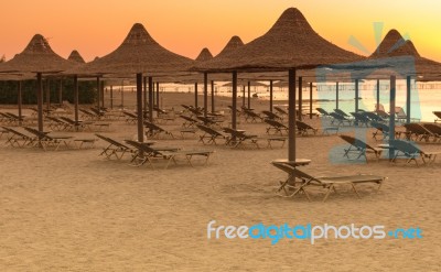 Tropical Beach Huts At Sunrise Stock Photo