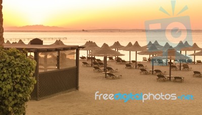 Tropical Beach Huts At Sunrise Stock Photo